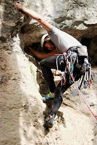 rock climbing man climbing mountain climbing